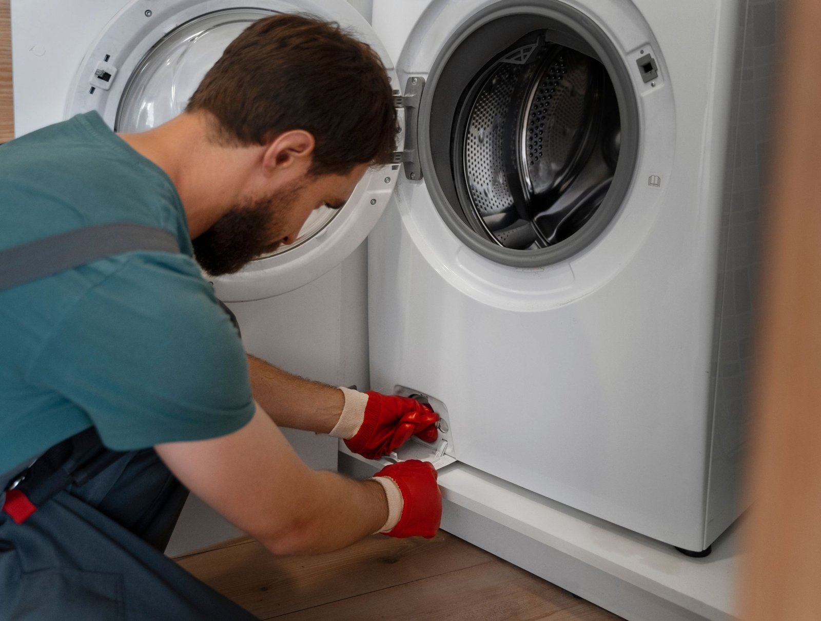 man working washing machine repair